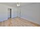 Bedroom features wood-look floors, neutral walls, and a closet at 3127 W Lambright St # A, Tampa, FL 33614