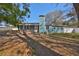 Charming single-story home with blue siding, a walkway ramp, and a chimney at 3127 W Lambright St # A, Tampa, FL 33614