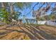 Cozy one-story home with blue siding, a ramp, chimney, and lots of tree coverage at 3127 W Lambright St # A, Tampa, FL 33614