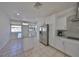 Bright kitchen features white cabinets, stainless appliances, and a granite island at 3127 W Lambright St # A, Tampa, FL 33614