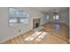 Light-filled living room boasting wood floors and a classic brick fireplace at 3127 W Lambright St # A, Tampa, FL 33614