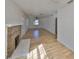 Bright living room featuring wood floors and a brick fireplace at 3127 W Lambright St # A, Tampa, FL 33614