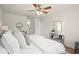 Serene main bedroom boasting a king-size bed, neutral tones, and stylish furnishings creating a peaceful sanctuary at 3507 King George Ln, Seffner, FL 33584