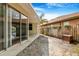 A cozy backyard features a covered patio and wood fence, creating an inviting outdoor space at 3616 Cypress Meadows Rd, Tampa, FL 33624