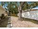 Backyard featuring lush trees providing shade, and a pathway to enjoy the garden at 3616 Cypress Meadows Rd, Tampa, FL 33624