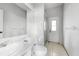 Neutral bathroom features large vanity, tile floors, and a glass enclosed shower at 3616 Cypress Meadows Rd, Tampa, FL 33624