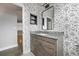 Charming bathroom features unique octopus wallpaper, grey vanity, and tile floors at 3616 Cypress Meadows Rd, Tampa, FL 33624