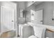 Neutral bathroom features a vanity sink, tile floors, and natural light at 3616 Cypress Meadows Rd, Tampa, FL 33624