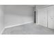 Cozy bedroom with plush gray carpet, neutral walls, closet and a window with natural light at 3616 Cypress Meadows Rd, Tampa, FL 33624