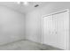 Bedroom with carpet flooring, ceiling fan, and standard closet at 3616 Cypress Meadows Rd, Tampa, FL 33624