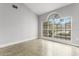 Bedroom featuring a large window with views of the neighborhood at 3616 Cypress Meadows Rd, Tampa, FL 33624