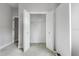 Open closet with shelving and carpeting inside a neutral-colored room at 3616 Cypress Meadows Rd, Tampa, FL 33624