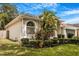 This home has an attractive garden and yard with mature landscaping and lush vegetation at 3616 Cypress Meadows Rd, Tampa, FL 33624