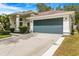 Beautiful home featuring a well-kept lawn, mature landscaping and a two-car garage at 3616 Cypress Meadows Rd, Tampa, FL 33624
