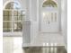 Bright foyer with tiled floor, double front door and arched transom window at 3616 Cypress Meadows Rd, Tampa, FL 33624