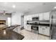 Bright kitchen features white cabinets, stainless steel appliances, and granite countertops, offering a modern and functional space at 3616 Cypress Meadows Rd, Tampa, FL 33624