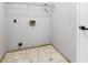 Laundry room featuring tiled floors and hookups for a washer and dryer at 3616 Cypress Meadows Rd, Tampa, FL 33624