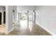 Bright, open living room with large windows and polished concrete floors at 3616 Cypress Meadows Rd, Tampa, FL 33624