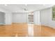 Bright living room with sliding glass doors, a ceiling fan, and neutral paint at 3616 Cypress Meadows Rd, Tampa, FL 33624
