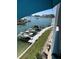 Water view overlooking boat docks, lush landscaping, and Intracoastal waterway at 610 Island Way # 402, Clearwater Beach, FL 33767