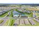 Aerial view of a Primary-planned community with pools, lakes, playgrounds, and tennis and basketball courts at 6127 164Th E Ave, Parrish, FL 34219