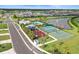 Aerial view of neighborhood amenities: pool, playground, tennis and basketball courts within a well-kept community at 6127 164Th E Ave, Parrish, FL 34219