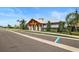 A spacious community clubhouse offers residents gathering space and is surrounded by lush landscaping and mature trees at 6127 164Th E Ave, Parrish, FL 34219