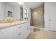 Bright bathroom with granite countertops, double sinks, and a glass-enclosed shower at 6127 164Th E Ave, Parrish, FL 34219