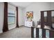 Bedroom features carpeted floors, window with blinds and curtains, bunk beds and a dresser at 6127 164Th E Ave, Parrish, FL 34219