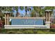 The Aviary at Rutland Ranch community sign is surrounded by lush landscaping, enhancing curb appeal and community pride at 6127 164Th E Ave, Parrish, FL 34219