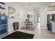 Dining room featuring modern decor, a stylish mirror, and a spacious layout at 6127 164Th E Ave, Parrish, FL 34219
