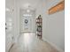Inviting entryway featuring light tile floors and a decorative welcome sign at 6127 164Th E Ave, Parrish, FL 34219