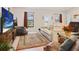 Comfortable living room featuring stylish decor, a modern TV, and ample seating at 6127 164Th E Ave, Parrish, FL 34219
