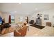 Spacious living area with a modern TV, large windows, and stylish furniture arrangement at 6127 164Th E Ave, Parrish, FL 34219