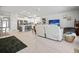 Bright open-concept living space with a modern kitchen and comfortable lounge area at 6127 164Th E Ave, Parrish, FL 34219
