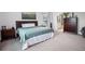 Comfortable main bedroom with ensuite bathroom, coordinated furnishings, and ample natural light at 6127 164Th E Ave, Parrish, FL 34219