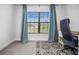 Well-lit office space with a large window, stylish curtains, and a comfortable desk setup at 6127 164Th E Ave, Parrish, FL 34219