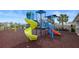 Community playground with a variety of colorful play structures, including slides and climbing areas for enjoyment at 6127 164Th E Ave, Parrish, FL 34219