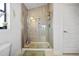 Modern walk-in shower with sleek glass door and contemporary tile surround at 6127 164Th E Ave, Parrish, FL 34219