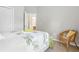 Bedroom with an accent chair, neutral carpet, and an ensuite bathroom at 6134 Fishhawk Crossing Blvd, Lithia, FL 33547