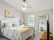 Bright bedroom features a large window, ceiling fan, and a full-length mirror at 6134 Fishhawk Crossing Blvd, Lithia, FL 33547