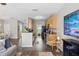 Open-concept living area with views of the kitchen and dining space, perfect for entertaining guests at 6134 Fishhawk Crossing Blvd, Lithia, FL 33547