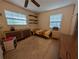 Bedroom with neutral walls, carpet, and two windows with horizontal blinds allowing ample light at 6144 10Th S Ave, Gulfport, FL 33707