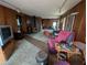 Living room with wood paneled walls and an unique fireplace at 6144 10Th S Ave, Gulfport, FL 33707