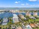 Aerial view highlights the condo's location near tennis courts, boat slips, and easy access to the water at 690 Island Way # 1003, Clearwater Beach, FL 33767