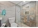 Modern bathroom features a glass shower door and decorative tile design at 690 Island Way # 1003, Clearwater Beach, FL 33767