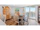 Dining room featuring a view, wood floors and seaside decor at 690 Island Way # 1003, Clearwater Beach, FL 33767