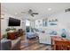 Inviting living room with a comfortable sectional sofa, stylish decor, and access to a scenic outdoor balcony at 690 Island Way # 1003, Clearwater Beach, FL 33767