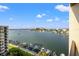 Stunning view of the water from a balcony with sailboats and surrounding waterfront condos at 690 Island Way # 1003, Clearwater Beach, FL 33767