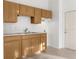 Cozy kitchenette with wood cabinets and white countertops at 8117 River Point Dr, Weeki Wachee, FL 34607